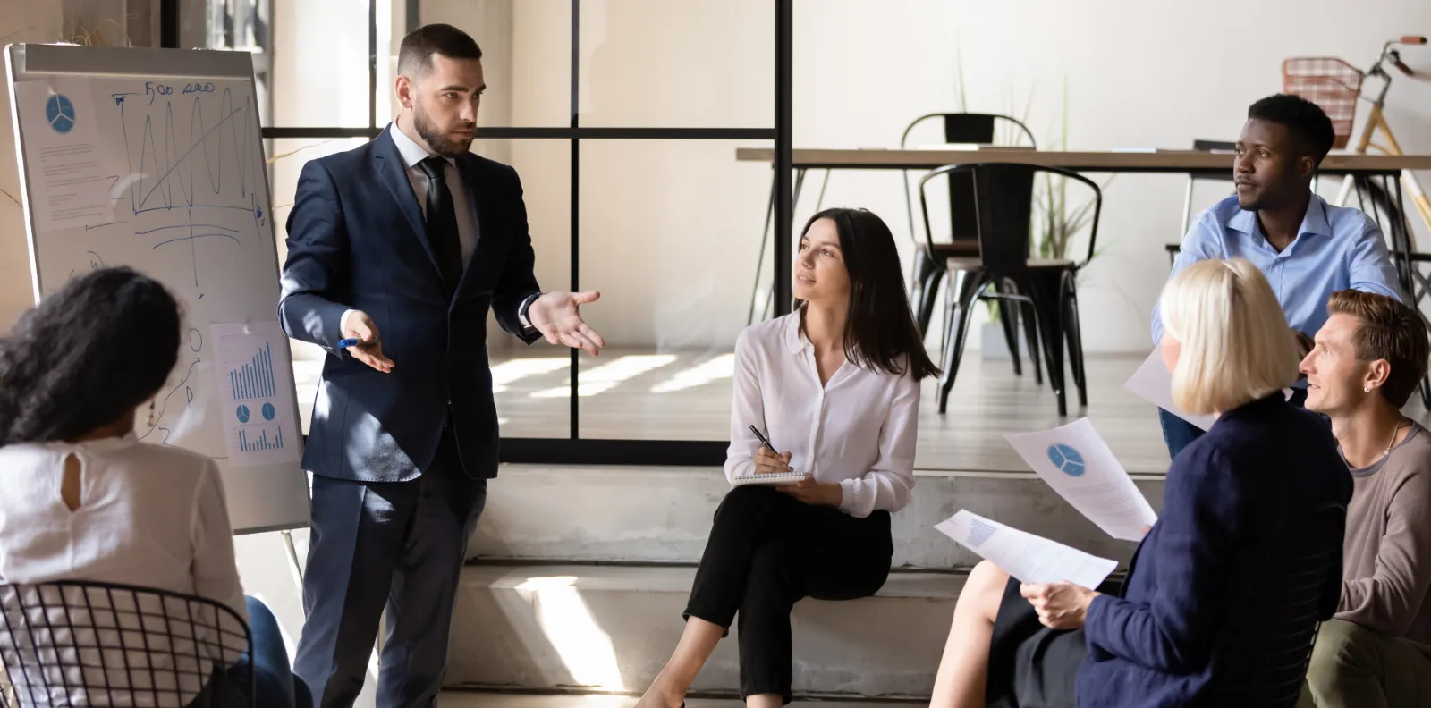 Business professionals talking in a modern office lounge